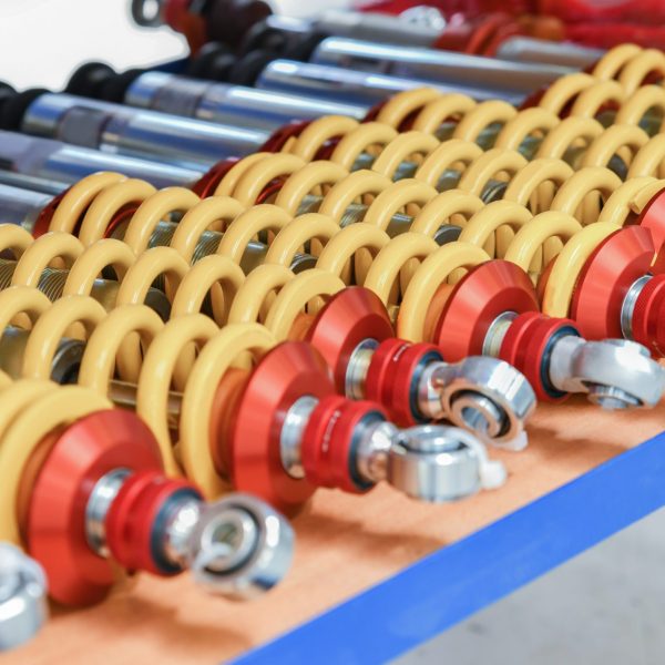 A row of red shock absorbers for car